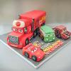3D shaped car cake. Price band F (excluding additional cars)